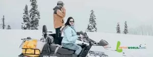 Akshay Bellubi and wife enjoying a thrilling snowmobile ride in Finnish Lapland - Finland tour from Hyderabad.